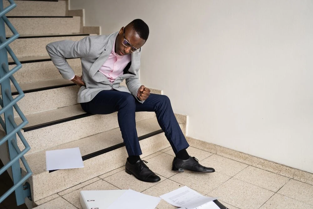 Fall And Fall Injury Accident At Workplace. Man Fell Down Stairs